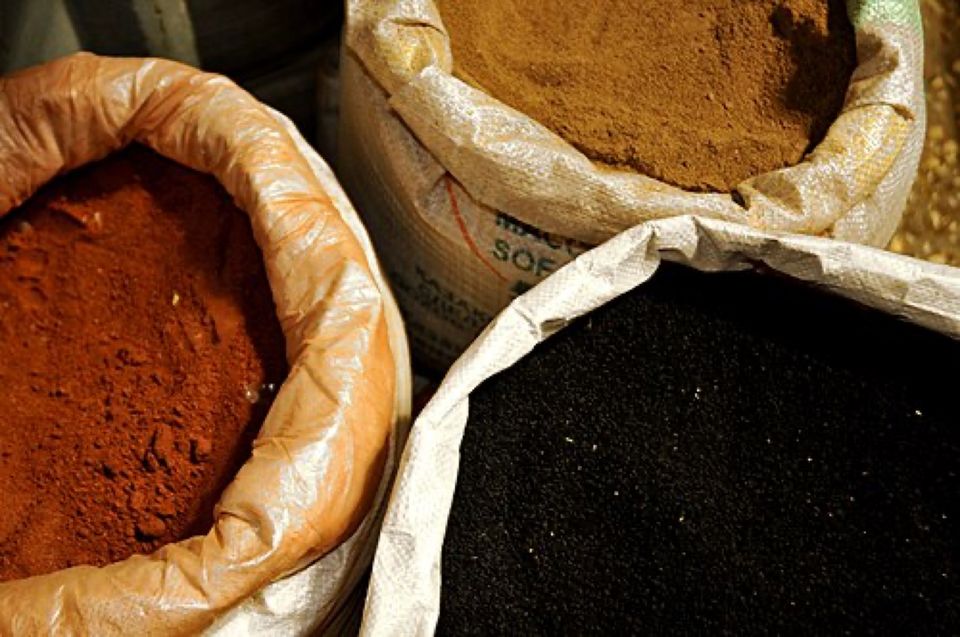 Open sacks of ground spices and seeds
